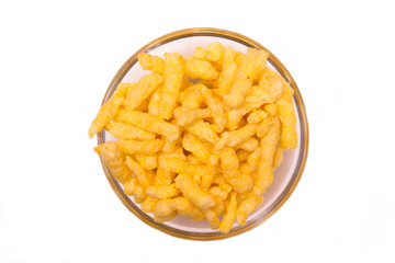 Snack corn cheese on bowl on white background top view