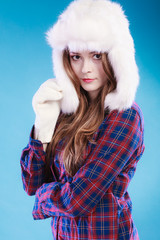 Young woman in winter clothing fur cap