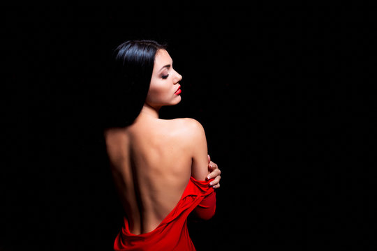 Elegant woman in red dress getting stripped