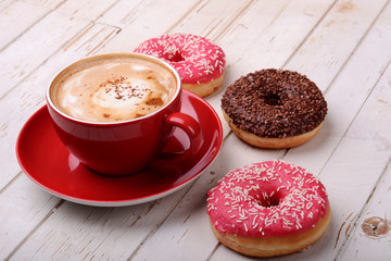 Cup of coffee and donuts 
