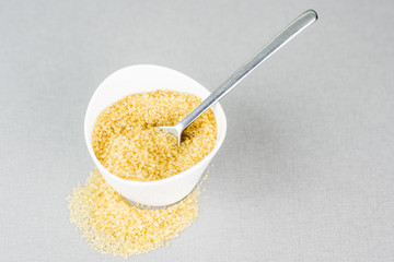 white ceramic bowl full of cane sugar