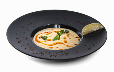 Chicken yogurt cream soup seasoned with red sauce isolated
