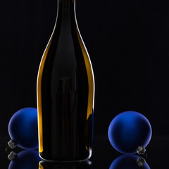 The bottle of red wine and Christmas decoration