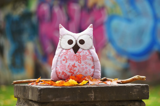 Handmade textile sewed owl with autumn leaves