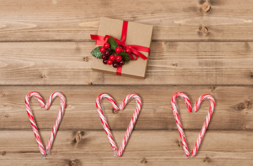 Christmas Background. Candy Canes, Heart Shape. Gift Box. Wooden