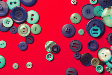 Fototapeta premium blue buttons - composition on a red background