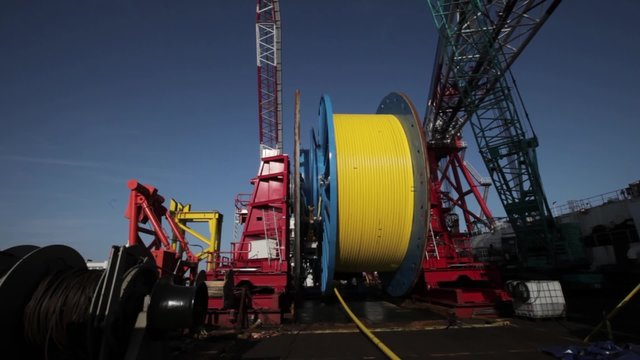Laying of underwater optical cable on sea bottom