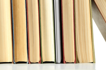 Stack of books with laptop close up