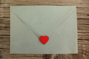 Blue love letter on wooden background