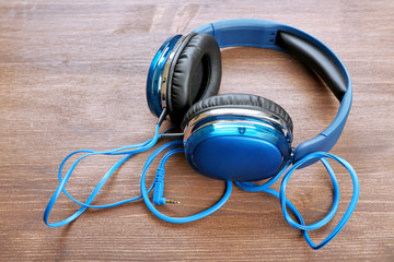 Headphones on wooden background