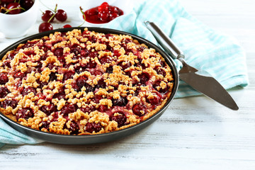 Tasty homemade pie with cherries on table close up