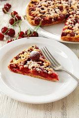 Tasty homemade pie with cherries on table close up
