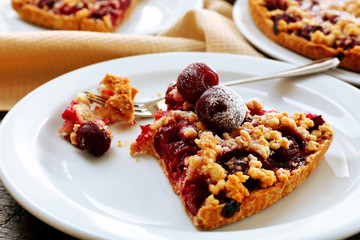 Tasty homemade pie with cherries on table close up