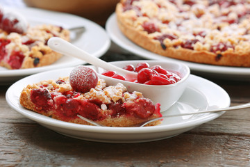 Tasty homemade pie with cherries on table close up
