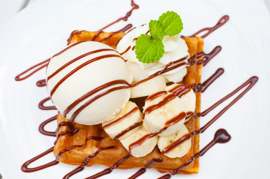 Close Up Ice Cream Waffle Banana With Chocolate Sauce And Mint L