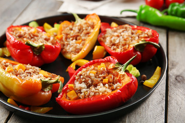 Stuffed peppers with vegetables on table close up