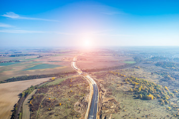 Sunset over road under construction