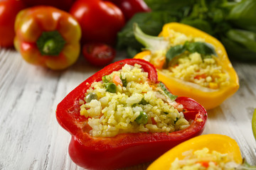 Stuffed peppers with vegetables on table close up