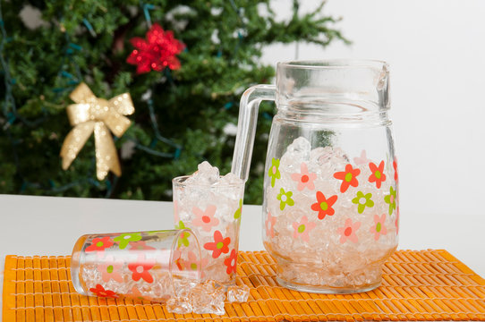pitcher with glasses Christmas tree background