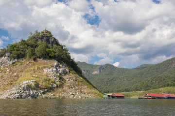 Amazing Buddhist temple on the island Phra Phutthabat (Buddha's footprint) Kao Nam Temple locate on the mountain at Mae Ping lake. Tak ,Thailand.