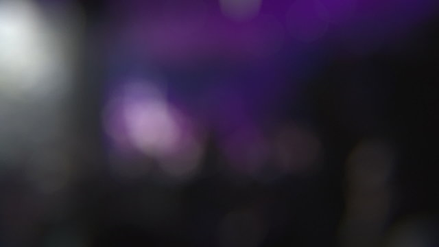 Night Club Dance Floor Background. Out of focus bokeh background with strobe lights illuminating and flickering on the dance floor.