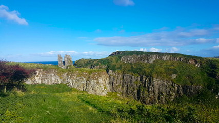 Irish Cliffside Ruins. Old ruins overlook a beautiful green cliffside in Northern Ireland.