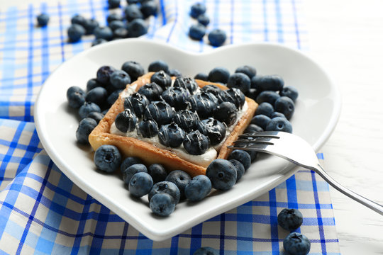 Gourmet fresh blueberry tart on plate, close up