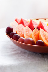Cutting  of Tropical Fruits and Berries: water-melon, papaya, grapes