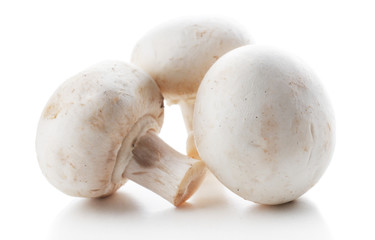 A bunch of champignon mushrooms isolated on white background