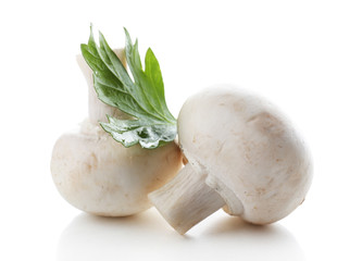 Champignon mushrooms and parsley isolated on white background