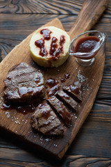 Grilled marbled beef schnitzels and potato puree, studio shot