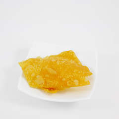 The Chinese delicious fried crispy dumpling (wonton) on the white small plate.