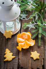 Christmas decorations: flashlight, tangerine, ginger biscuits, s