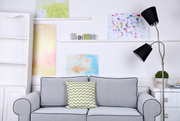 Beautiful modern living room with grey sofa and floor lamp