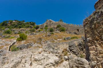 Fototapeta na wymiar The sea, the sky and the ruins of the old defensive wall.