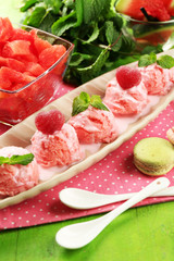 Watermelon ice cream in bowl  on color wooden background