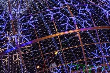 christmas lights holiday decoration in city street as background
