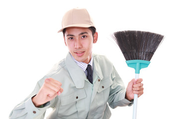 ガッツポーズの清掃員