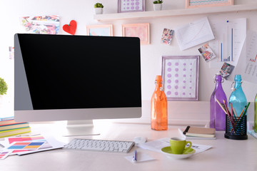 Modern workplace with computer on the table in decorated room