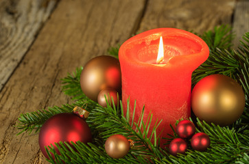 Burning candle at festive christmas arrangement