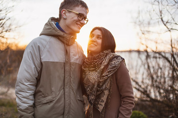 Cheerful couple standing on the beach