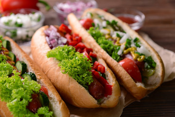 Hot dogs and vegetables on craft paper closeup