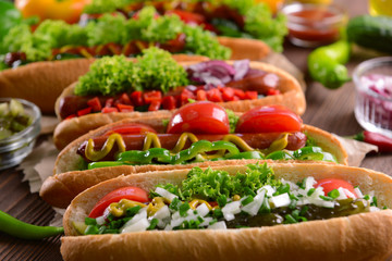 Hot dogs and vegetables on craft paper closeup