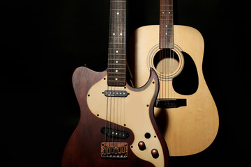 Fototapeta na wymiar Electric and acoustic guitars on dark grey background