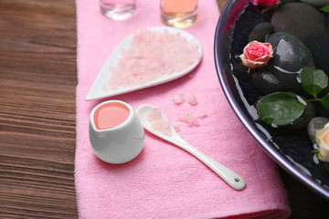 Spa composition of flowers and stones in water, close-up