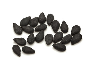 Macro closeup of Organic Black Sesame (Sesamum indicum) isolated on white background.