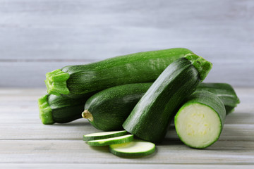 Fresh zucchini on wooden background