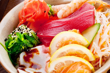 Traditional japanese food - salad with raw seafood and citrus fr