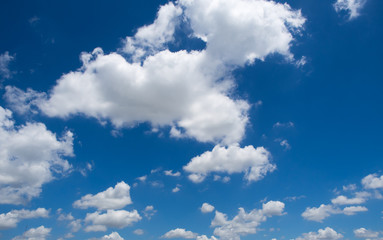Blue sky background with white clouds on the bright day summer.