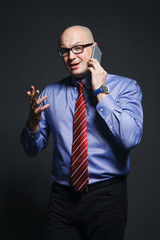 Angry businessman talking on phone
